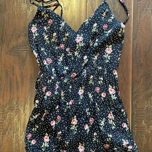 Black romper with pink flower details